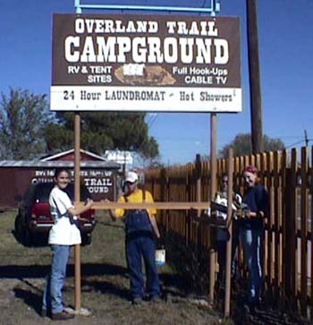 UT Students Painting Sign Posts